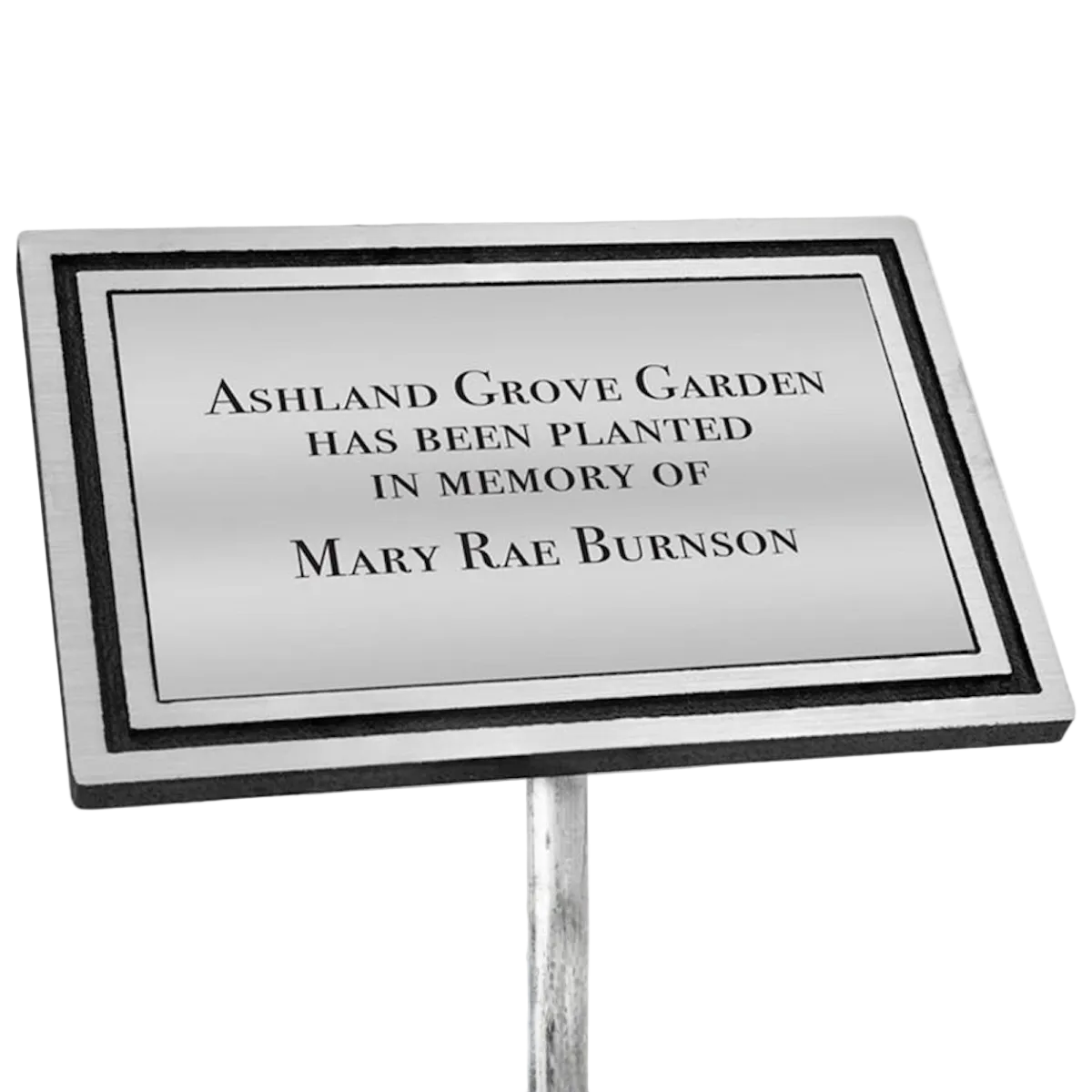 Memorial plaque with engraved text on a white background