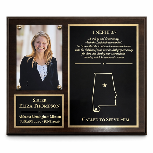 Plaque with a photo of a woman, text, and a map of Alabama on a white background