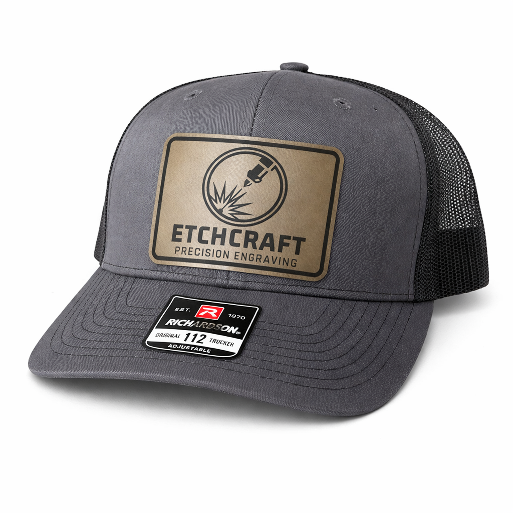 Gray trucker cap with Etchcraft logo on a white background