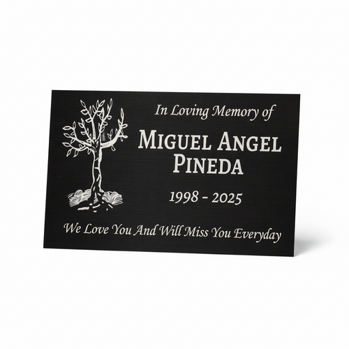Memorial plaque with tree design and text for Miguel Angel Pineda on a white background