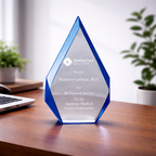 Acrylic award with blue base and white top on a wooden desk, featuring 'Somerset Medical Center' text.