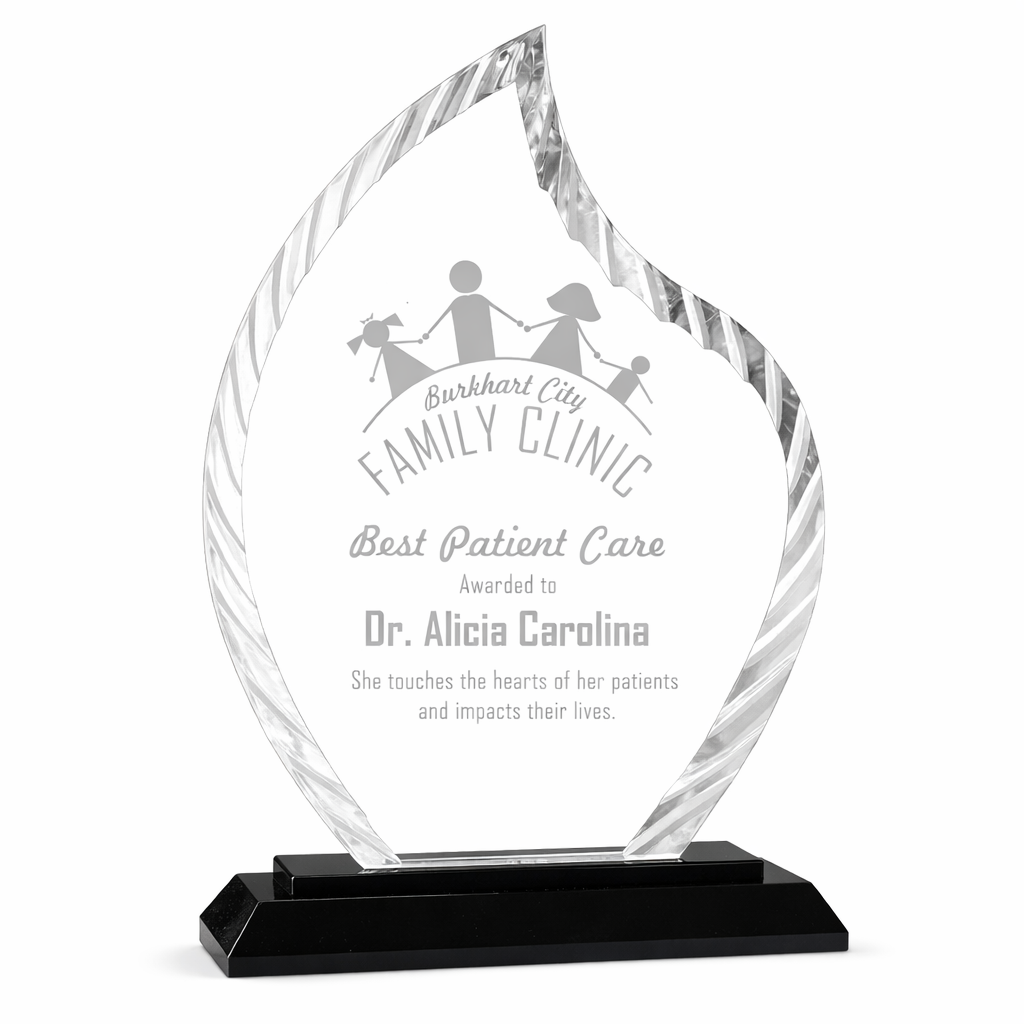 Crystal award with engraved text on a white background