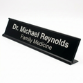 Black nameplate with 'Dr. Michael Reynolds Family Medicine' text on a white background
