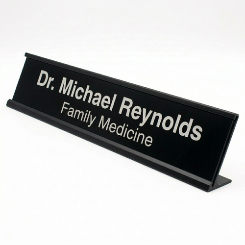 Black nameplate with 'Dr. Michael Reynolds Family Medicine' text on a white background