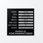 Technical specifications label for a machine or equipment, featuring model number, date, serial number, weight, load capacity, grade, and motor details, with 'Property of Acme Manufacturing' at the bottom.