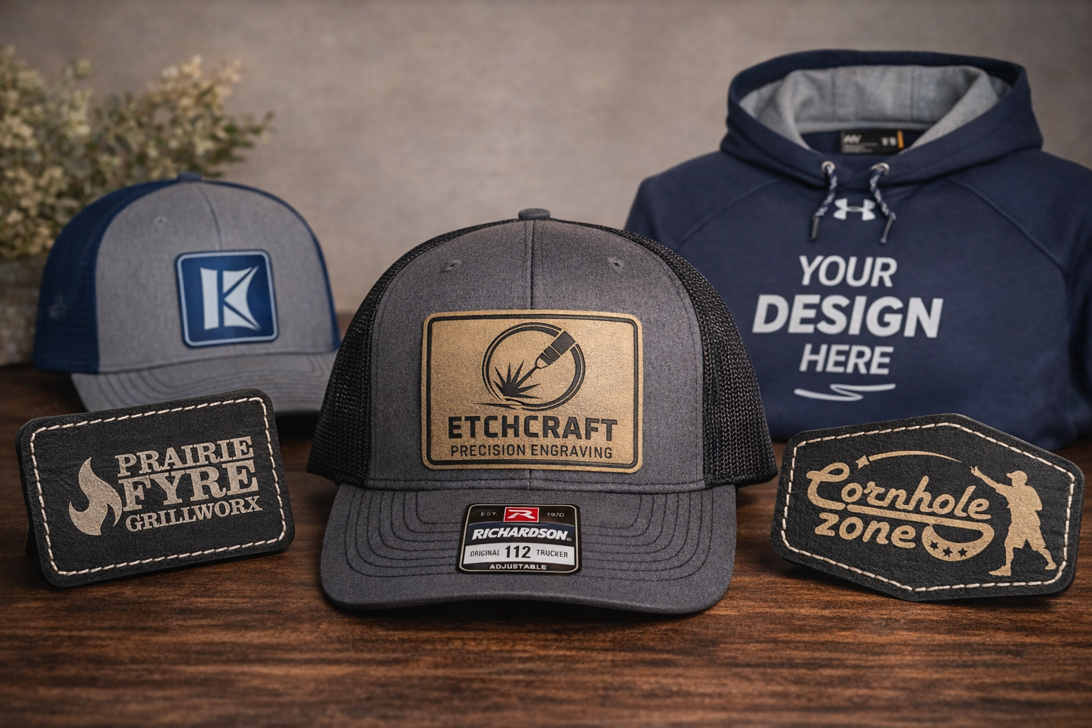 Collection of personalized hats and apparel items  on a wooden surface with a neutral background.